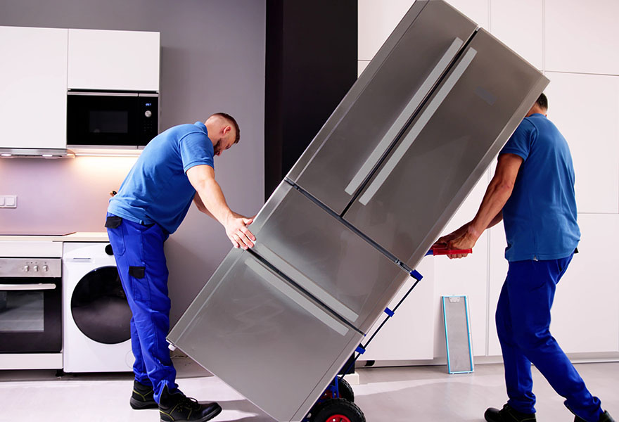 Experienced team remove old electrical appliance